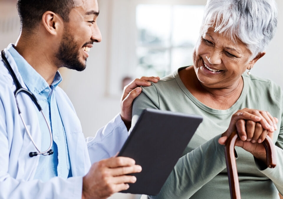 Shot of a young doctor sharing information from his digital tablet with an older patient